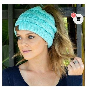 Winter hat with pony tail hole at top